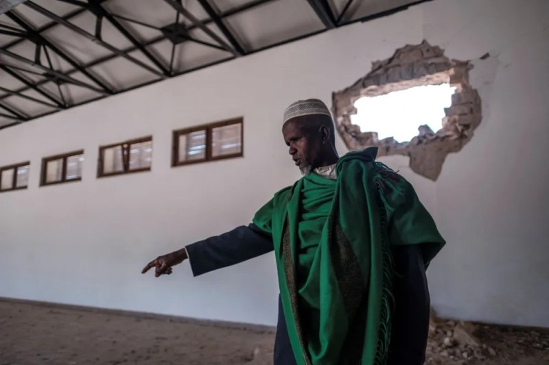 An Ethiopian Muslim stands in a damaged building at the al-Nejashi Mosque, one of the oldest in Africa and allegedly damaged by Eritrean shelling, in Negash, Ethiopia on March 1.