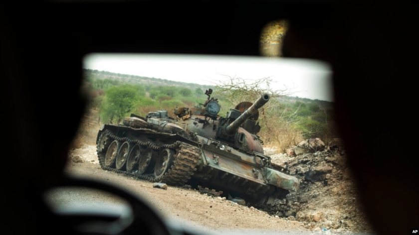 FILE - A destroyed tank is seen by the side of the road south of Humera in western Tigray, then annexed by the Amhara region, in Ethiopia, May 1, 2021. 